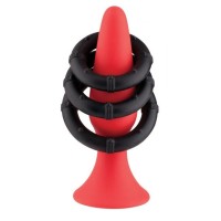 Набор из красного анального плага и 3 черных эрекционных колец Набор из красного анального плага и 3 черных эрекционных колец