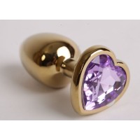 Золотистая анальная пробка с сиреневым стразиком-сердечком - 7,5 см. Золотистая анальная пробка с сиреневым стразиком-сердечком - 7,5 см.