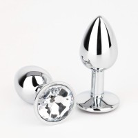 Серебристая анальная втулочка с прозрачным кристаллом - 7 см. Серебристая анальная втулочка с прозрачным кристаллом - 7 см.