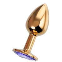 Золотистая анальная втулка с фиолетовым стразом - 7 см. Золотистая анальная втулка с фиолетовым стразом - 7 см.